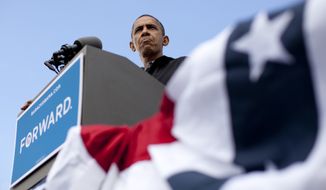 President Obama speaks Aug. 13, 2012, during a campaign event at Bayliss Park in Council Bluffs, Iowa, during a three-day campaign bus tour through the state. (Associated Press)