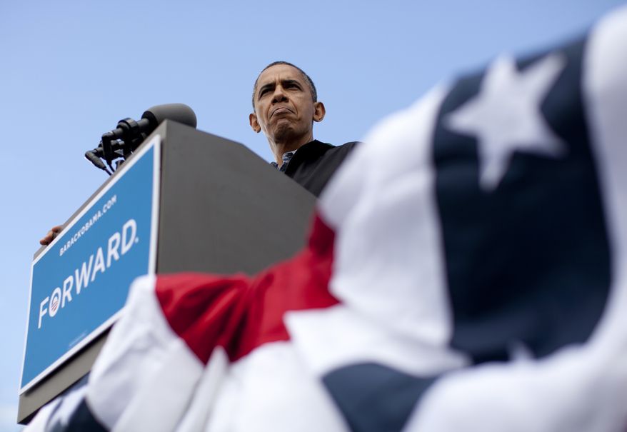President Obama speaks Aug. 13, 2012, during a campaign event at Bayliss Park in Council Bluffs, Iowa, during a three-day campaign bus tour through the state. (Associated Press)