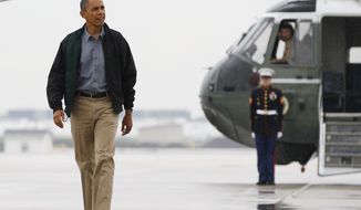 President Obama walks from Marine One to board Air Force One at O&#39;Hare International Airport on Aug. 13, 2012, in Chicago, en route to Offutt Air Force Base in Bellevue, Neb., and onto a three-day campaign bus tour through Iowa. (Associated Press)