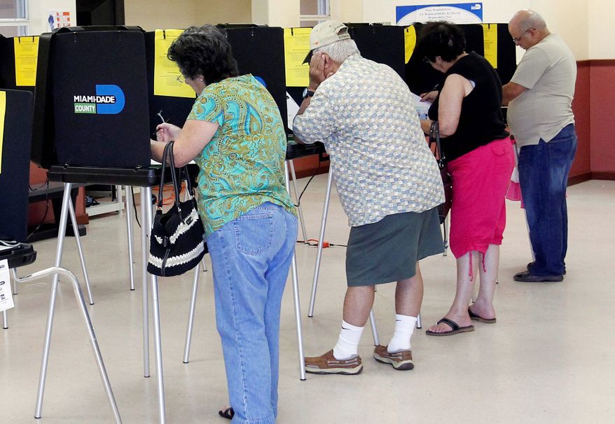 Voters fill out their ballots at Precinct 326 in Hialeah, Fla., during the state&#x27;s primary election on Tuesday, Aug. 14, 2012. (Associated Press)