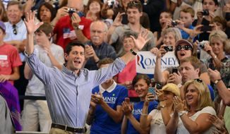 Republican vice presidential candidate Paul Ryan of Wisconsin waves Aug. 14, 2012, to supporters as he enters during a campaign rally in Lakewood, Colo. (Associated Press)