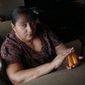 Sandra Pico, 52, holds her medications July 26, 2012, at her home in North Miami Beach, Fla. Pico makes about $15,000 a year working about 20 hours a week as a home health aide — a bit too much to qualify for Medicaid, but not enough that she can afford private insurance. (Associated Press)