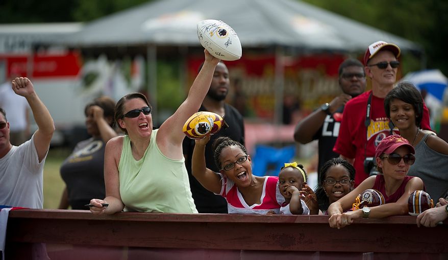 Redskins fans cry out for Chris Cooley along the sidelines following Redskins training camp at Redskins Park in Ashburn, Va., Tuesday, August 14, 2012. This is the last day that fans will be able to watch their team practice in this area. Next year the Redskins will move their practice facility to the Richmond, Va., area. (Rod Lamkey Jr./The Washington Times)