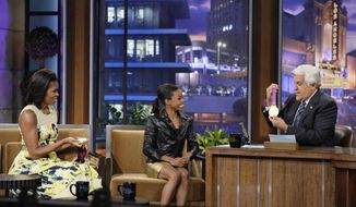 First lady Michelle Obama (left) and Olympic gold medalist Gabby Douglas appear with host Jay Leno during a taping of &quot;The Tonight Show With Jay Leno&quot; in Burbank, Calif., on Monday, Aug. 13, 2012. (AP Photo/NBC, Margaret Norton)