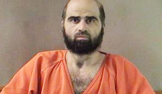 Maj. Nidal Malik Hasan, an Army psychiatrist, has been charged with premeditated murder and attempted premeditated murder in the November 2009 attack at Fort Hood, Texas. (Associated Press)