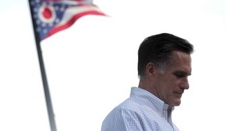 **FILE ** The Ohio flag flies in the background as Republican presidential candidate Mitt Romney speaks during a campaign event at the Ross County Courthouse in Chillicothe, Ohio, on Tuesday, Aug. 14, 2012. (AP Photo/Mary Altaffer)
