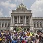 Hundreds of demonstrators descend on the Capitol in Harrisburg, Pa., on Tuesday, July 24, 2012, to protest a tough new voter ID law. (AP Photo/The Harrisburg Patriot-News, John C. Whitehead)