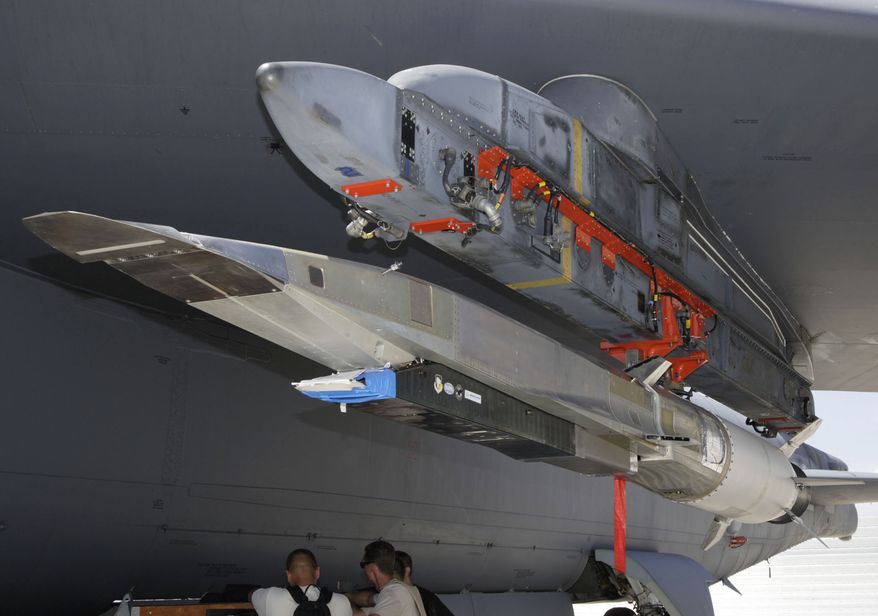 An X-51A Waverider hypersonic flight test vehicle is uploaded to an Air Force Flight Test Center B-52 for fit testing at Edwards Air Force Base in California in July 2009. (Associated Press) ** FILE **

