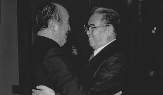 **FILE** The Rev. Sun Myung Moon hugs North Korean President Kim Il Sung. (Courtesy of H.S.A.-U.W.C.)