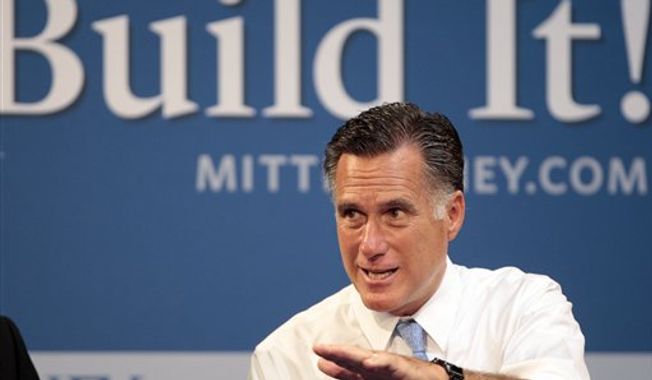 **FILE** Republican presidential candidate Mitt Romney hosts a small-business roundtable July 23, 2012, during a campaign stop at Endural LLC in Costa Mesa, Calif. (Associated Press)