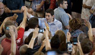 ** FILE ** Republican vice presidential candidate, Rep. Paul Ryan, R-Wis., greets supporters at Walsh University in North Canton, Ohio, Thursday, Aug. 16, 2012. (AP Photo/Tribune Review, Justin Merriman)