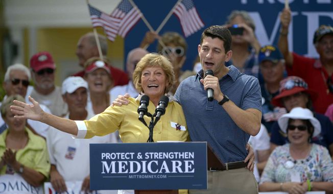 Rep. Paul Ryan, the Republican vice presidential candidate, introduces his mother, Betty Ryan Douglas, to supporters Aug. 18, 2012, at a campaign rally in The Villages, Fla. (Associated Press)