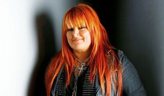 Country singer Wynonna Judd poses for a portrait at the Gibson Guitar Lounge during the Sundance Film Festival in Park City, Utah, in January 2009. (AP Photo/Mark Mainz)