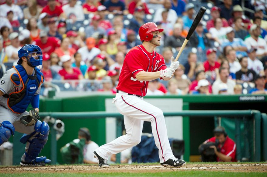Washington Nationals Bryce Harper (34) watches the ball as he hits an RBI triple, scoring Jayson Werth in the bottom of the third inning. (Rod Lamkey Jr./The Washington Times)