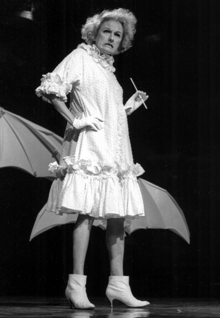 In this undated file photo, Comedian Phyllis Diller performs in character. Diller, the housewife turned humorist who aimed some of her sharpest barbs at herself, died Monday, Aug. 20, 2012, at age 95 in Los Angeles. (AP Photo/NBC-TV, File)