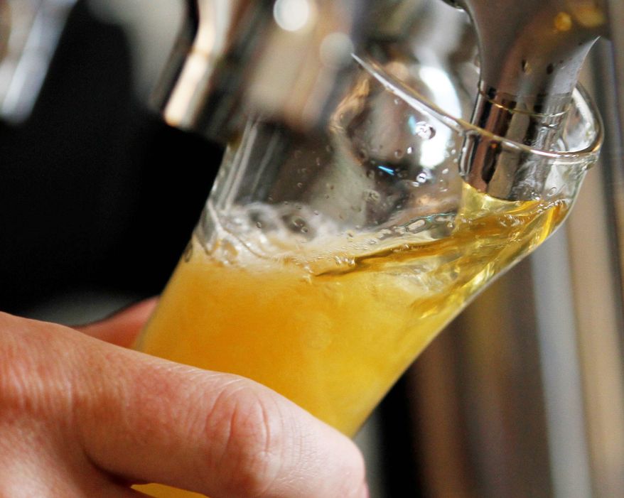 A sample being poured at Hardywood Park Craft Brewery is one of more than a dozen the brewery produces, some available at retail and others only on tap there. (Associated Press)