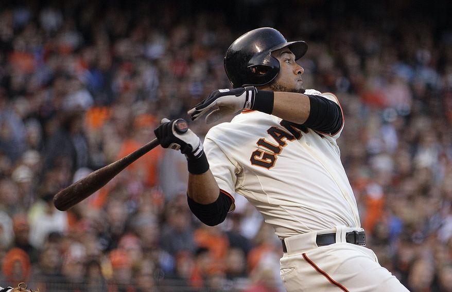 FILE - This July 14, 2012 file photo shows San Francisco Giants' Melky Cabrera swinging for an RBI single off Houston Astros' Lucas Harrell in the fifth inning of a baseball game in San Francisco. Cabrera has been suspended for 50 games without pay after testing positive for testosterone. The commissioner's office says the suspension is effective immediately. Major League Baseball said on Wednesday, Aug. 15, 2012, that Cabrera tested positive for the banned performance-enhancing substance, which violates MLB's joint drug prevention and treatment program.(AP Photo/Ben Margot, File)