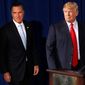 Mitt Romney (left) and Donald Trump stump in Las Vegas in August. (Associated Press)