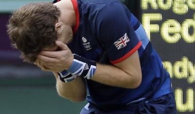 Andy Murray of Great Britain reacts after defeating Roger Federer of Switzerland in the gold medal men&#39;s singles match at the All England Lawn Tennis Club in Wimbledon, London at the 2012 Summer Olympics, Sunday, Aug. 5, 2012. (AP Photo/Elise Amendola)
