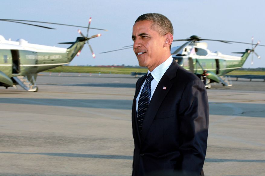 President Obama arrives Aug. 22, 2012, at JFK International Airport in New York en route to a visit in New York City, where he planned to attends several fundraiser events. (Associated Press)