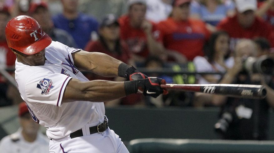 Texas Rangers' Adrian Beltre follows through on hitting a home run during the fourth inning of a baseball game against the Baltimore Orioles, Wednesday, Aug. 22, 2012, in Arlington, Texas. (AP Photo/LM Otero)