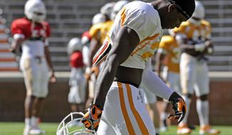 FILE - This April 6, 2012 file photo shows Tennessee wide receiver Da&#39;Rick Rogers looking down during football practice in Knoxville, Tenn. Tennessee has suspended Rogers for an unspecified violation of team rules. (AP Photo/The Knoxville News Sentinel, Amy Smotherman Burgess, File)