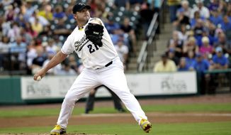 Sugar Land Skeeters Roger Clemens throws a pitch during a baseball game against the Bridgeport Bluefish Saturday, Aug. 25, 2012, in Sugar Land, Texas. Clemens, a seven-time Cy Young Award winner, signed with the Skeeters of the independent Atlantic League this week. (AP Photo/David J. Phillip)