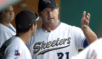 Sugar Land Skeeters pitcher Roger Clemens (21) talks with catcher Octavio Martinez, left, before a  baseball game against the Bridgeport Bluefish Friday, Aug. 24, 2012, in Sugar Land, Texas. Clemens, a seven-time Cy Young winner, signed with the Skeeters of the independent Atlantic League this week and is expected to start for the minor league team Saturday at home against Bridgeport. (AP Photo/David J. Phillip)