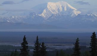 ** FILE ** Early morning sun shines on the south side of 17,400-foot Mount Foraker in Denali National Park on Sunday, Aug. 12, 2012, in a view from Talkeetna, Alaska. (AP Photo/Dan Joling)

