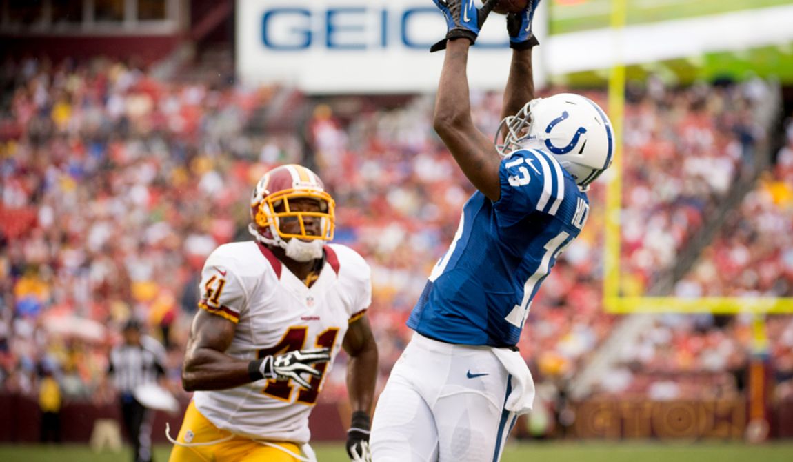 Washington Redskins defensive back Madieu Williams (41) can only watch as Indianapolis Colts wide receiver T.Y. Hilton (13) catches a touchdown pass to tie the game 7-7 in the second quarter as the Washington Redskins takes on the Indianapolis Colts in NFL preseason football at FedEx Field, Landover, Md., Saturday, August 25, 2012. (Andrew Harnik/The Washington Times)