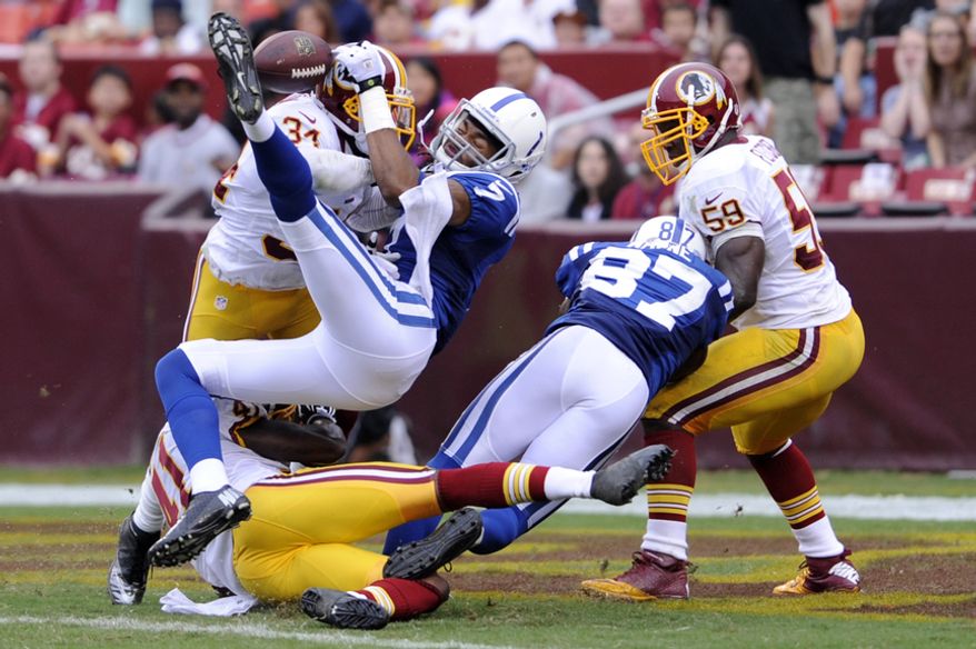 Washington Redskins defensive back Madieu Williams (41) and Washington Redskins running back Tanard Jackson (34) break up a pass Indianapolis Colts wide receiver Kris Adams (7) in the endzone at FedEx Field, Landover, Md. Aug. 25, 2012. (Preston Keres/Special to The Washington Times)