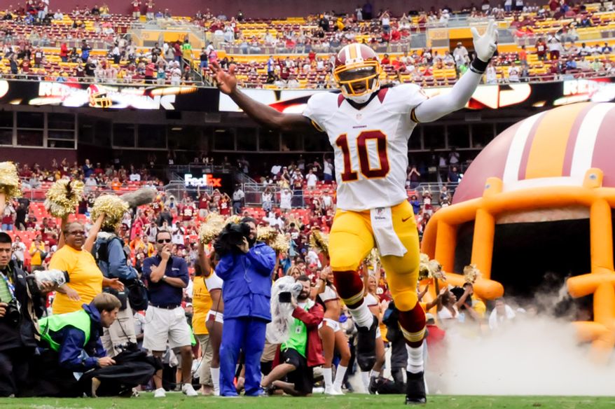 Washington Redskins quarterback Robert Griffin III (10) is introduced before his first game at FedEx Field, Landover, Md. Aug. 25, 2012. (Preston Keres/Special to The Washington Times)