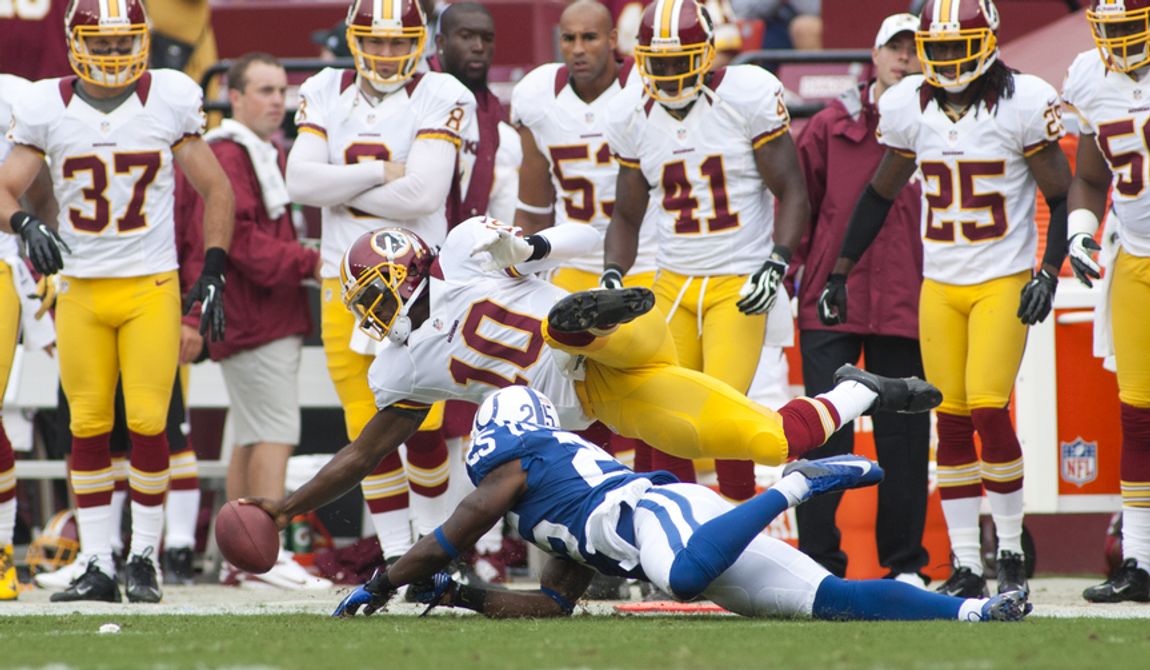 Washington Redskins quarterback Robert Griffin III (10) runs for a first down in the first half of the Indianapolis Colts at Washington Redskins preseason football game, Saturday, August 25, 2012 in Washington, DC. (Craig Bisacre/The Washington Times) 