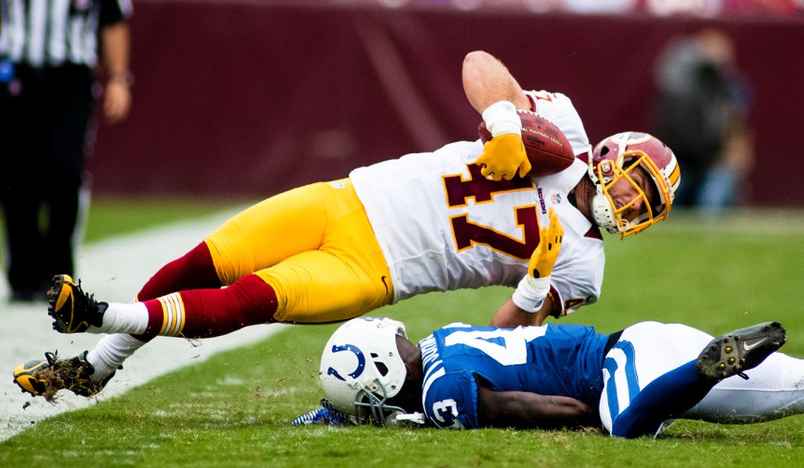 Washington Redskins tight end Chris Cooley (47) is hit by Indianapolis Colts defensive back DJ Johnson (43) during first half action of the Indianapolis Colts at Washington Redskins preseason football game, Saturday, August 25, 2012 in Washington, DC. (Craig Bisacre/The Washington Times)