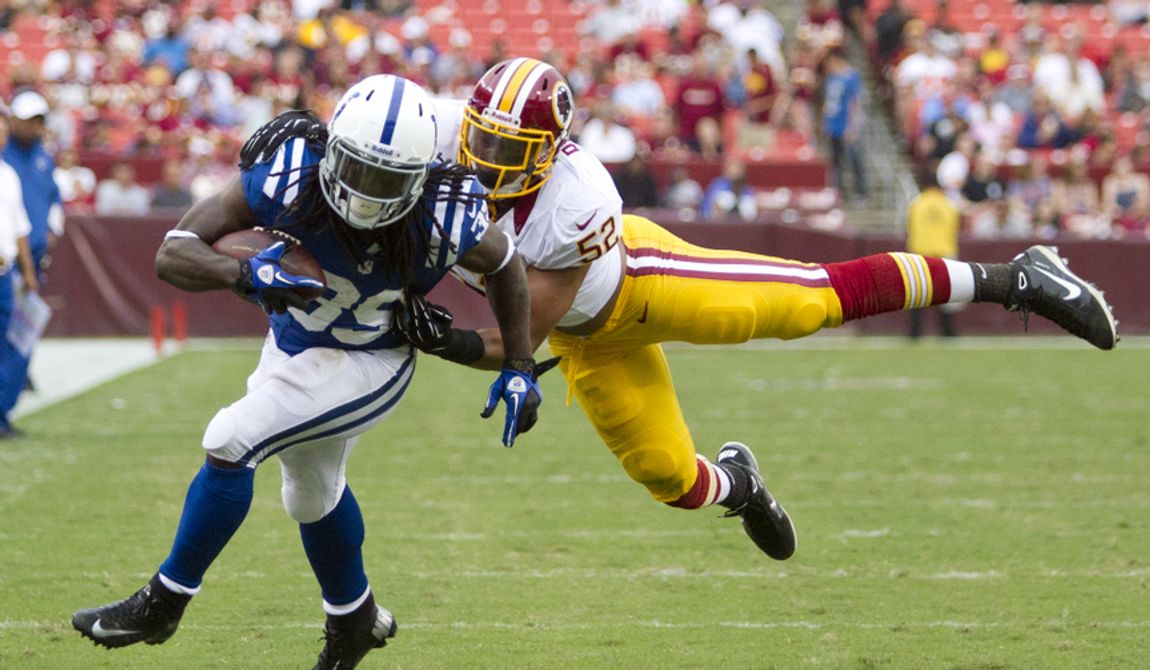 Washington Redskins linebacker Keenan Robinson (52) tackles Indianapolis Colts cornerback Cameron Chism (39) before he could reach the end zone in second half action of the Indianapolis Colts at Washington Redskins preseason football game, Saturday, August 25, 2012 in Washington, DC. (Craig Bisacre/The Washington Times) 