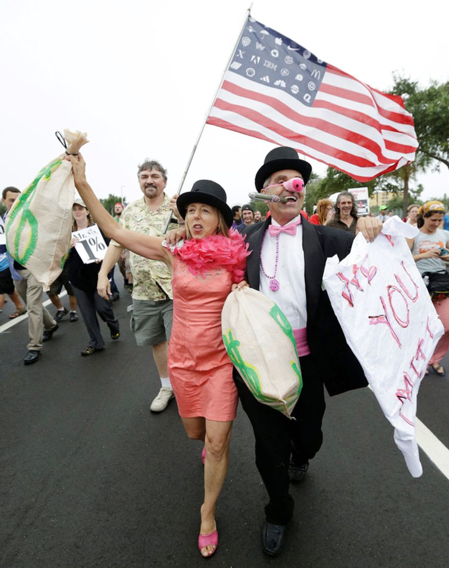 Demonstrators chant and walk during a protest march in St Petersburg, Fla. (AP Photo/Patrick Semansky)