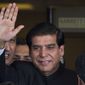 ** File ** Pakistani Prime Minister Raja Pervaiz Ashraf waves upon his arrival for a hearing at the Supreme Court in Islamabad on, Aug. 27, 2012. (Associated Press)