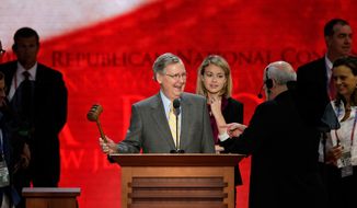 Senate Minority Leader Mitch McConnell, Kentucky Republican, checks out the stage Aug. 27, 2012, at the Republican National Convention inside the Tampa Bay Times Forum in Tampa, Fla. (Associated Press)