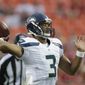Seattle Seahawks quarterback Russell Wilson (3) passes to a teammate during the first half of an NFL preseason football game against the Kansas City Chiefs in Kansas City, Mo., Friday, Aug. 24, 2012. (AP Photo/Charlie Riedel)