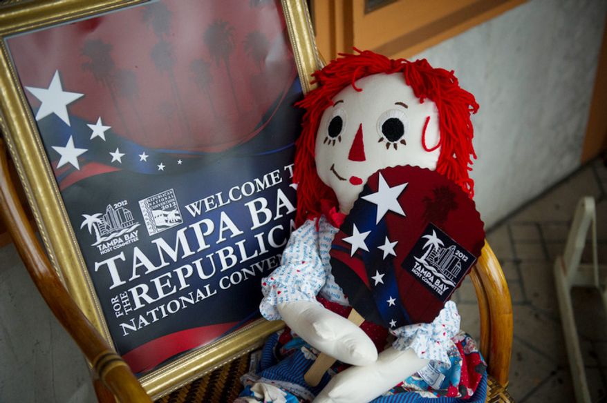 A Raggedy Ann doll holds a paper fan with the logo of the 2012 Republican National Convention at the store The Attic on Seventh, in Ybor City, Fla., Monday, August 27, 2012. (Rod Lamkey Jr./The Washington Times)