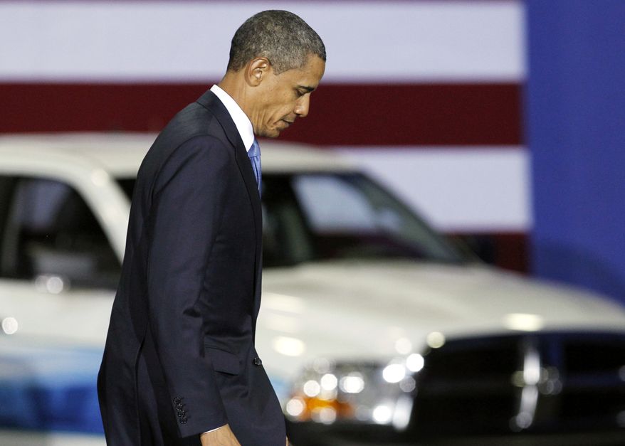 In this Friday, July 29, 2011, photo, President Barack Obama walks down a ramp after delivering a speech at a gathering where he announced new fuel efficiency standards for cars and light trucks at the Washington Convention Center in Washington.The average gas mileage of new cars and trucks will have to nearly double by 2025 under regulations that were finalized Tuesday, Aug. 28, 2012, by the Obama administration. The new rules would require the fleet of new cars and trucks to average 54.5 miles per gallon in 13 years, up from 28.6 mpg at the end of last year. (AP Photo/Manuel Balce Ceneta)