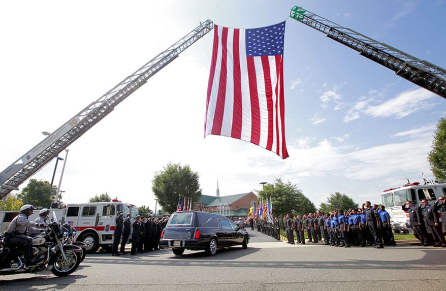 The funeral for Prince George's County police officer Adrian Morris begins at Woodstream Church in Mitchellville, MD, on August 28, 2012. Morris died in the line of duty on August 20, 2012. (Eva Russo/Special to The Washington Times)