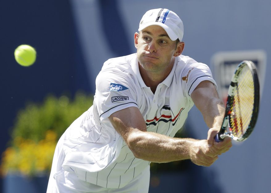 Andy Roddick returns a shot to Rhyne Williams at the 2012 US Open tennis tournament, Tuesday, Aug. 28, 2012, in New York. (AP Photo/Kathy Willens)