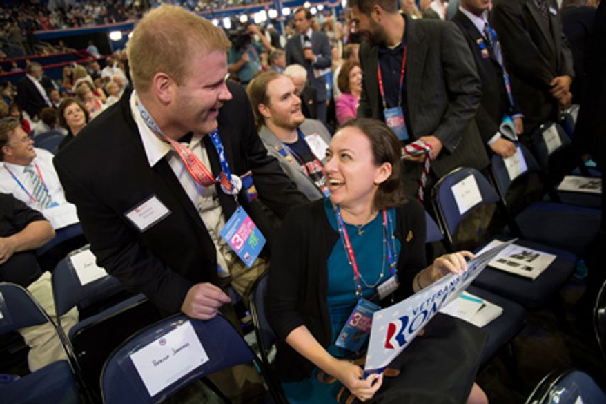 Massachusetts Delegate Elizabeth Mahoney, center, talks with delegate Brandon Navom of Lowell, Mass., at the Republican National Convention, Tampa, Fla., Wednesday, August 29, 2012. (Andrew Harnik/The Washington Times)