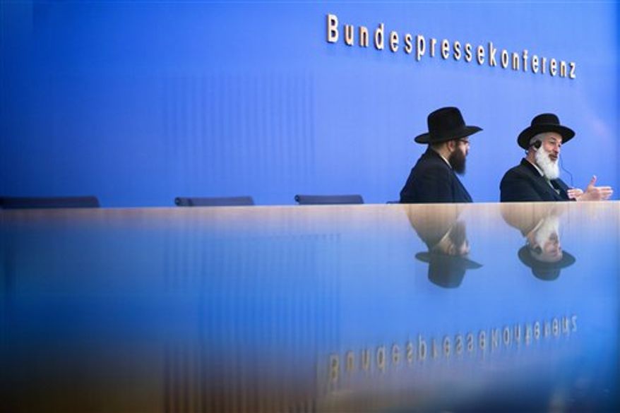Ashkenazi Chief Rabbi of Israel Yona Metzger, right, and Berlin Rabbi Yehuda Teichtal brief the media at the Federal Press Conference organization in Berlin, Tuesday, Aug. 21, 2012. Israel's chief rabbi is in Germany for talks aimed at smoothing over controversy over the legality of circumcising young boys. German lawmakers have called for the government to draft a law this fall explicitly permitting 'medically correct circumcision'. That call came after a Cologne court concluded in June that circumcision amounts to bodily harm. (AP Photo/Markus Schreiber)