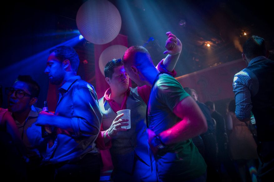 John Moore (left) and Chris Johns, both of Tampa, Fla., dance in the smoke-filled room and spotlights on the dance floor during Homocon 2012 at The Honey Pot, following the second night of he Republican National Convention in Tampa, Fla., Wednesday, Aug. 29, 2012. (Rod Lamkey Jr./The Washington Times)