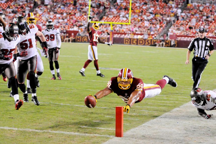 Washington Redskins running back Roy Helu (29) dives for a score on a 15-yard touchdown in the third quarter. (Preston Keres/Special to The Washington Times)