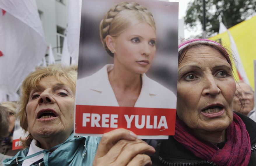 Supporters of former Ukrainian Prime Minister Yulia Tymoshenko take part in a rally outside Ukraine's High Specialized Court on Civil and Criminal Cases in Kiev on Wednesday, Aug. 29, 2012. The country's highest court on Wednesday upheld the guilty verdict against Tymoshenko, who is in jail on abuse-of-office charges. (AP Photo/Efrem Lukatsky)
