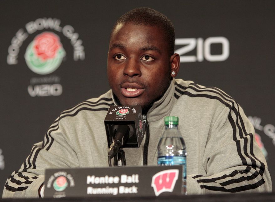 FILE - In this Dec. 28, 2011, file photo, Wisconsin running back Montee Ball speaks at a news conference in Los Angeles for the Rose Bowl NCAA college football game. Five men attacked the star running back near campus early Wednesday morning, Aug.1 , 2012, inflicting head injuries serious enough to send him to the hospital, authorities said. Ball, a Heisman Trophy finalist last season as a junior, was taken to a hospital with head injuries, police said. (AP Photo/Jason Redmond, File)