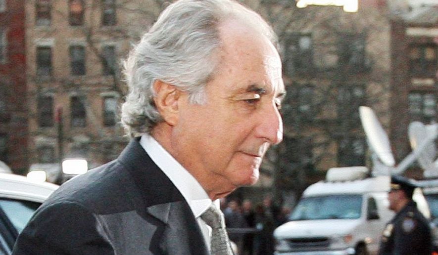 Bernard Madoff is serving a 150-year prison term for his Ponzi scheme that stole an estimated $36 billion from investors. (Associated Press) ** FILE **